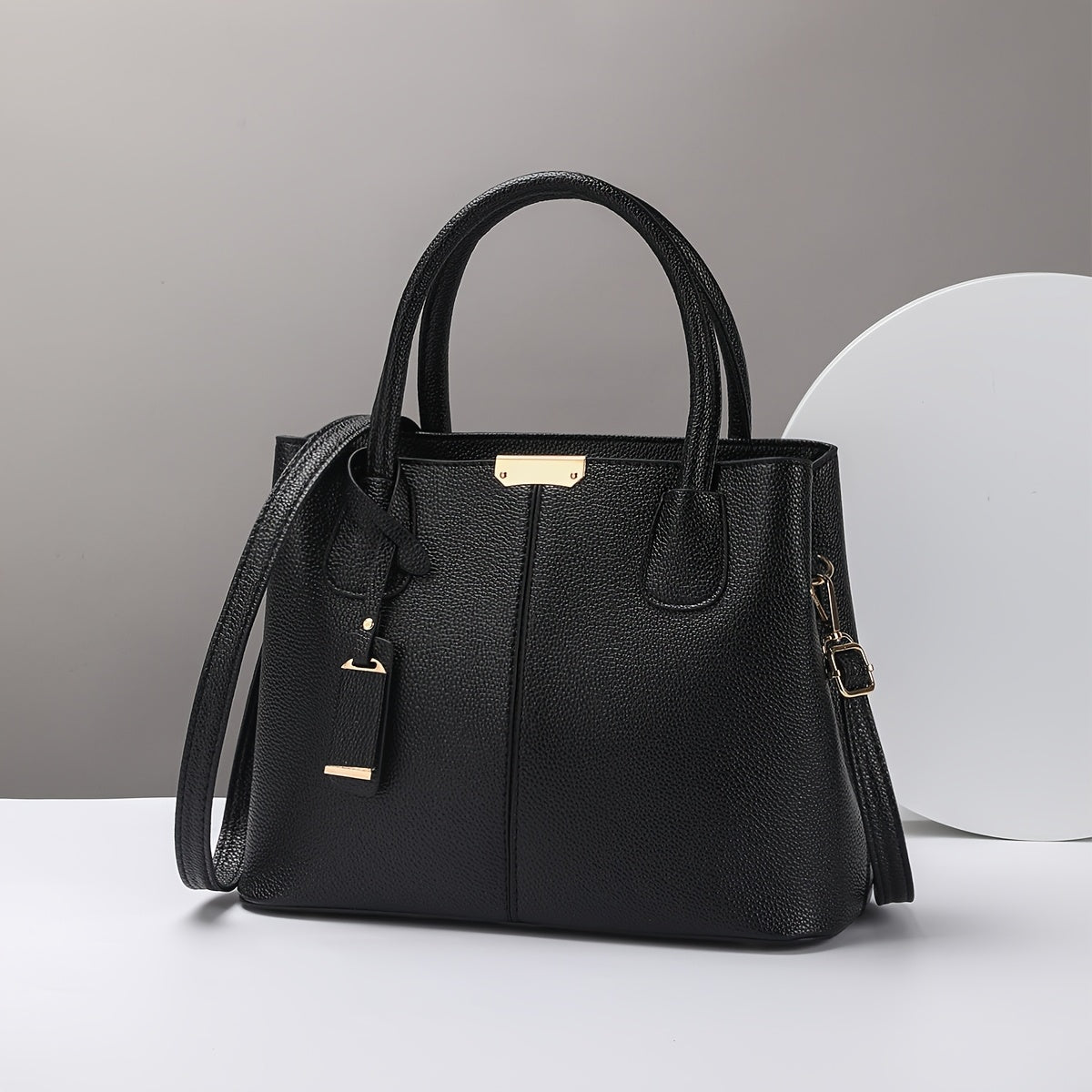 Stylish black quilted tote bag for women, with versatile crossbody and shoulder straps, golden-tone hardware, polyester lining, and zip closure - perfect for daily commuting.