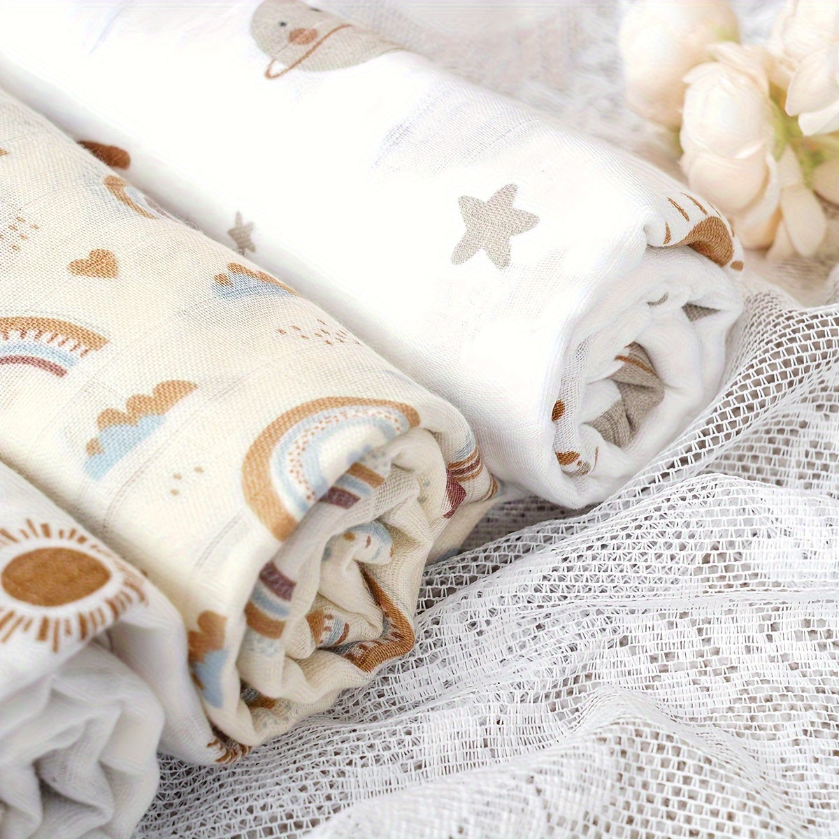 Three Elinfant Swaddle Blankets made from bamboo cotton muslin for newborns. These soft gauze bath towels are recommended for hand washing only and are suitable for children aged 0-3 years old.