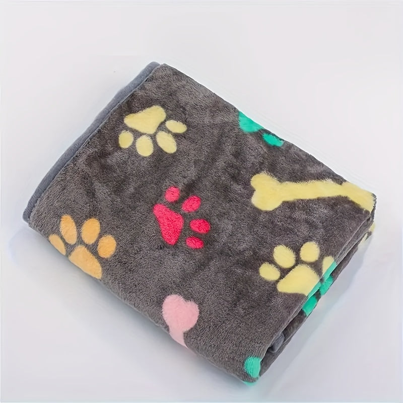 Soft and stain-resistant fleece pet blanket with bone pattern for all sizes of dogs and cats.