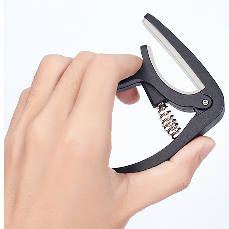 Quick change guitar capo clip for acoustic, classic, electric guitars, and ukulele. Universal adjustable clip.