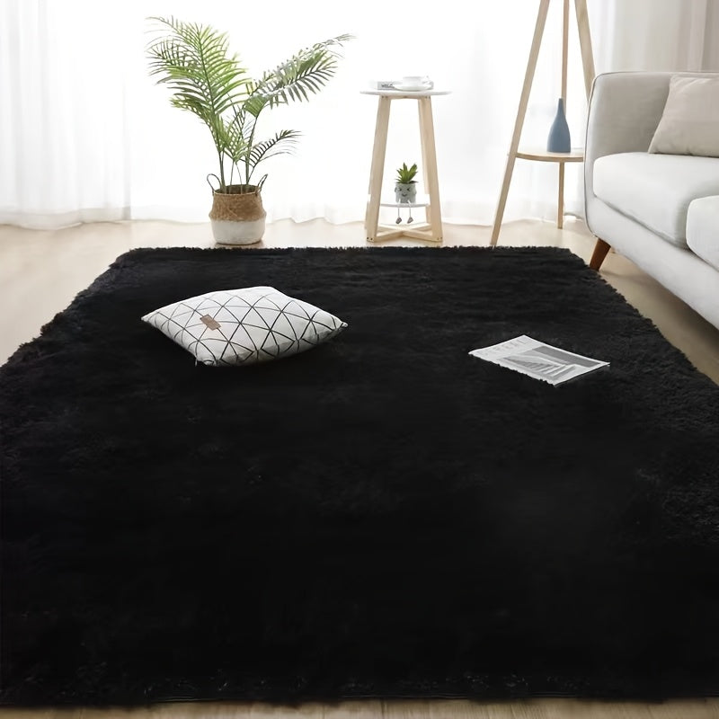 Luxurious soft plush faux fur area rug with anti-slip knitted polyester backing. This machine-made thick, warm, and fluffy mat is perfect for bedroom and living room use. It is hand washable and stain-resistant, making it easy to care for and