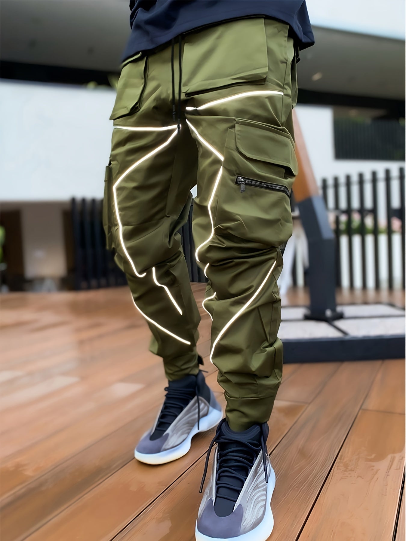 Men's loose straight cargo pants with multi pockets and reflective trend accents.