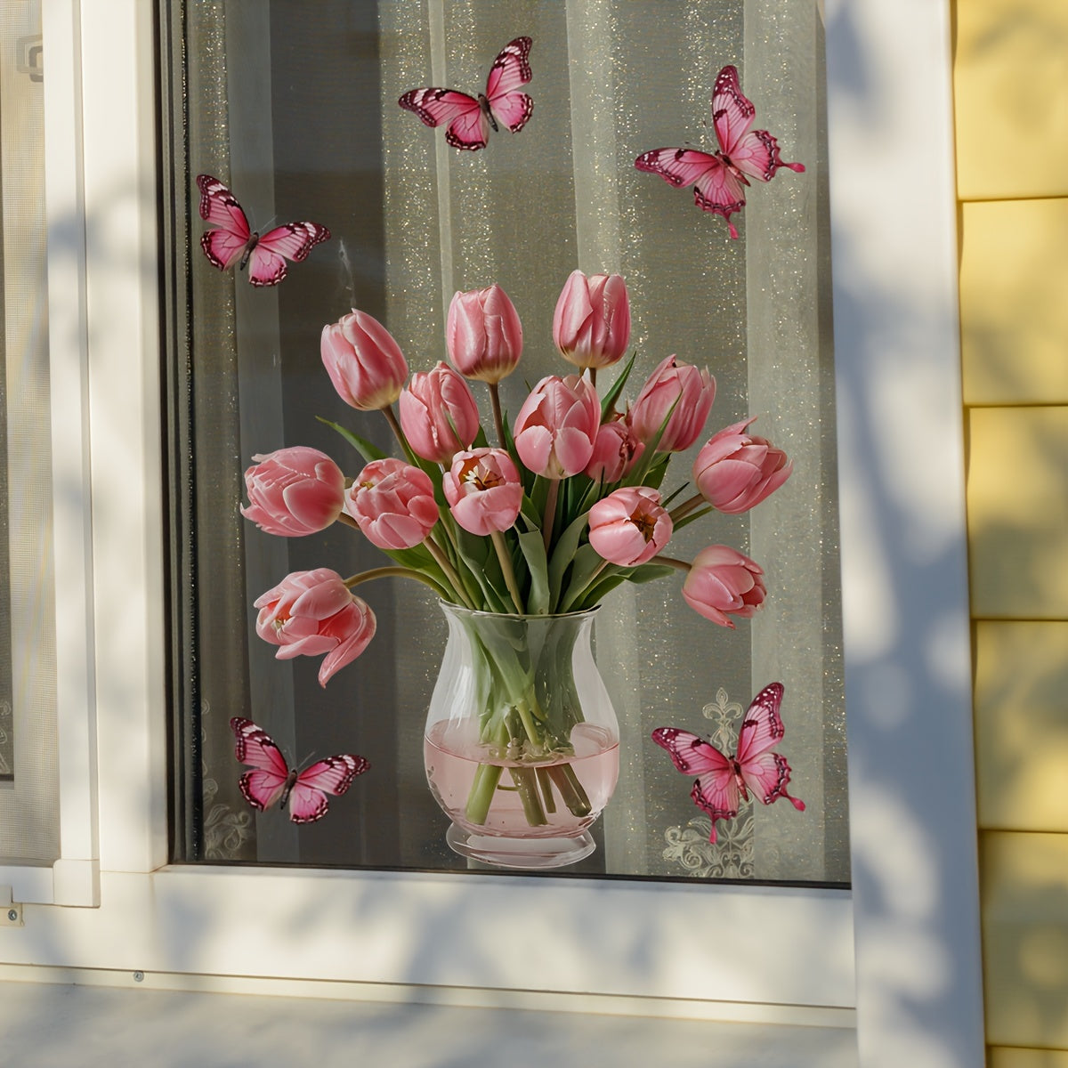 Contemporary Style Pink Tulip Butterfly Window Stickers, featuring a Floral Patterned design. Made from Polyvinyl Chloride Material, these stickers are easy to apply with their Static Cling Mounting and are reusable. Available in Assorted Shapes, these