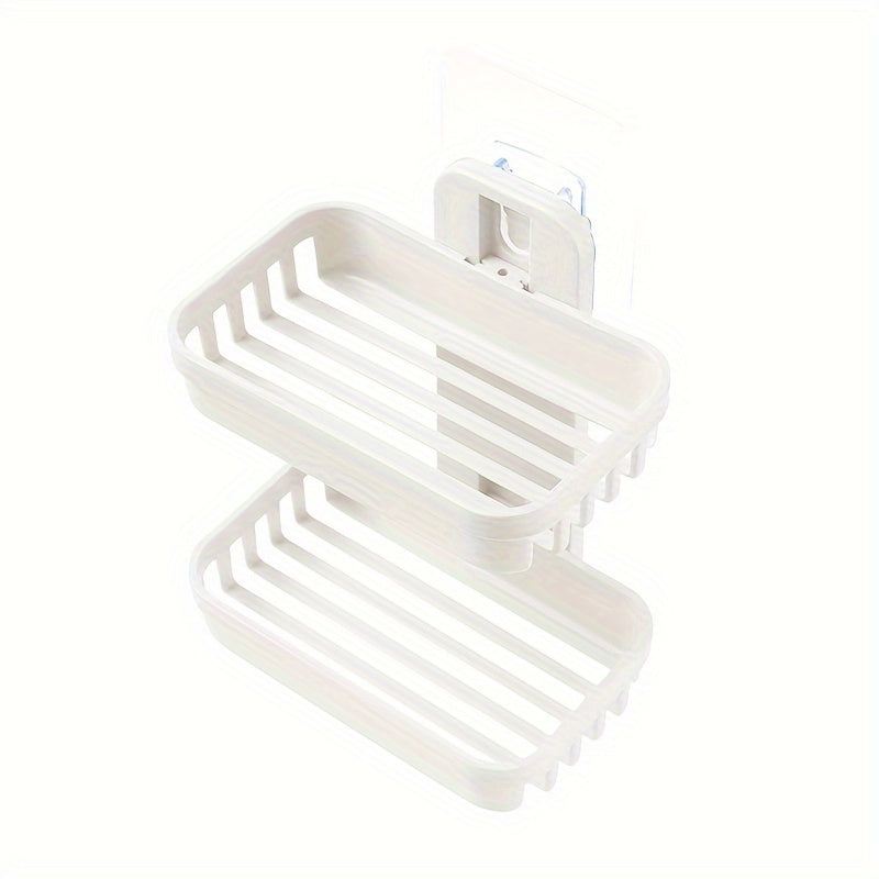 Wall-mounted soap holder with box drain for toiletries and shampoo.