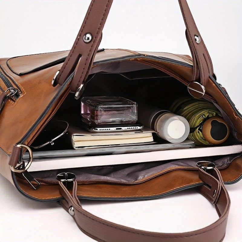 Vintage-style women's tote bag with adjustable strap, large capacity, multiple pockets, zipper closure, deep brown.