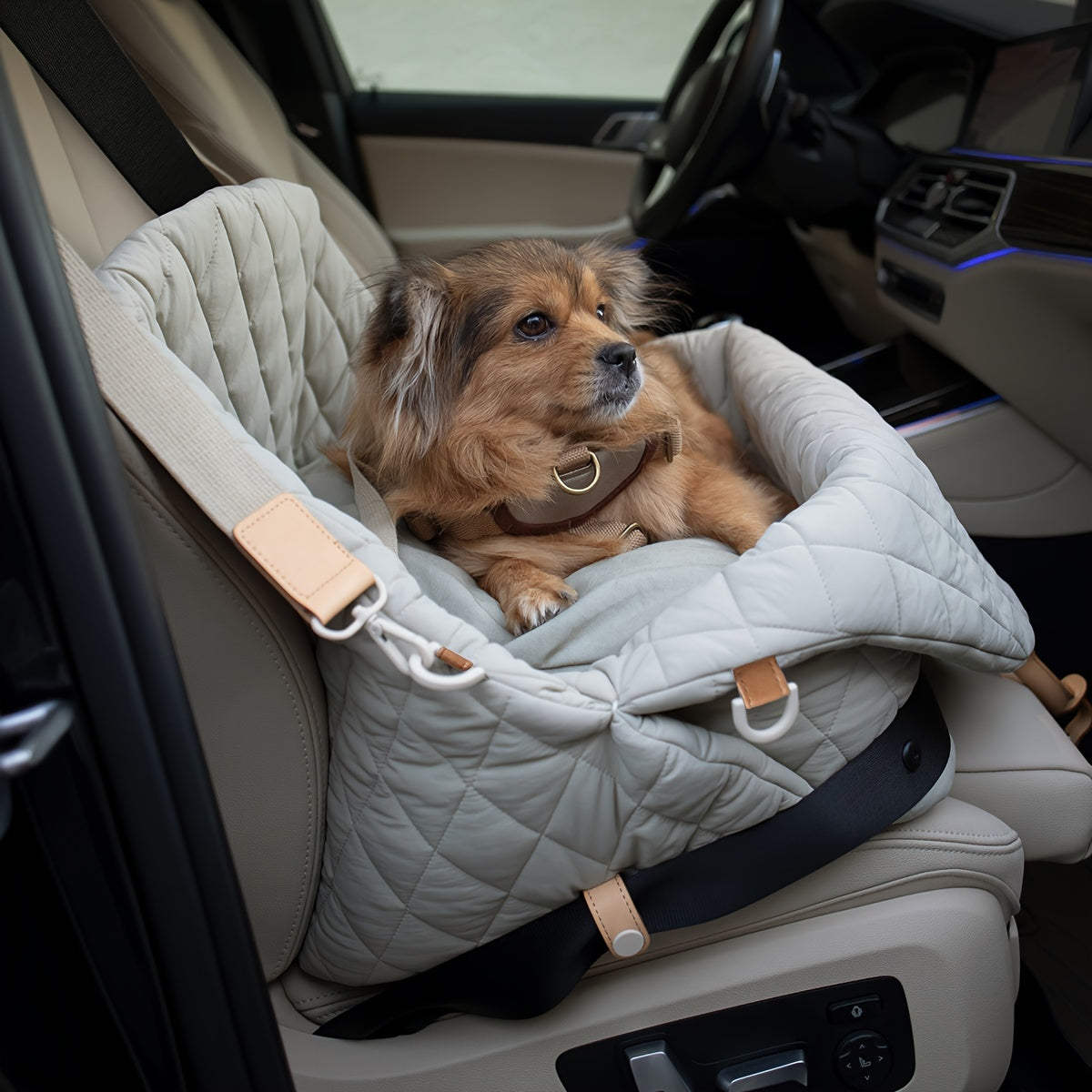 Versatile pet carrier bag doubles as a dog car seat for safe travel with a harness attachment. Carry your dog or cat securely.