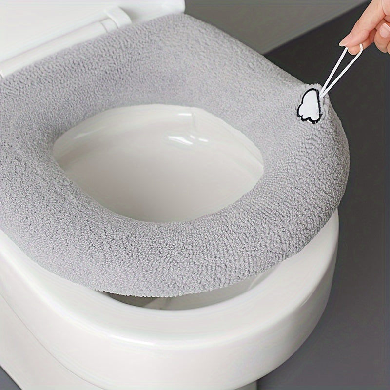 Soft, warm plush toilet seat cover for all seasons. Perfect bathroom accessory or holiday gift.