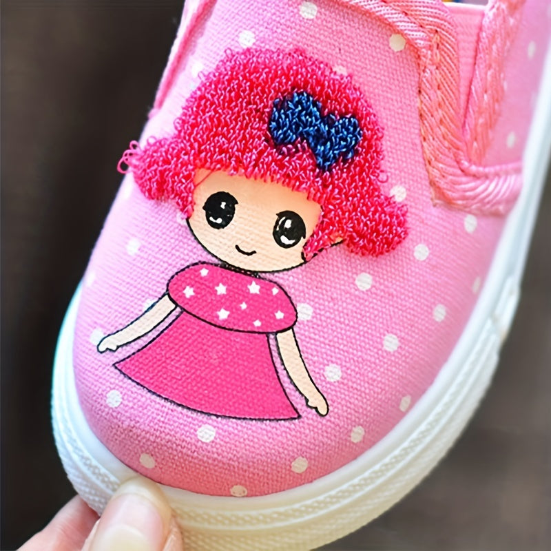 Adorable pink polka dot slip-on canvas shoes for girls featuring cute cartoon embroidery, breathable fabric, lightweight and comfortable for spring and fall. Durable TPR sole and easy