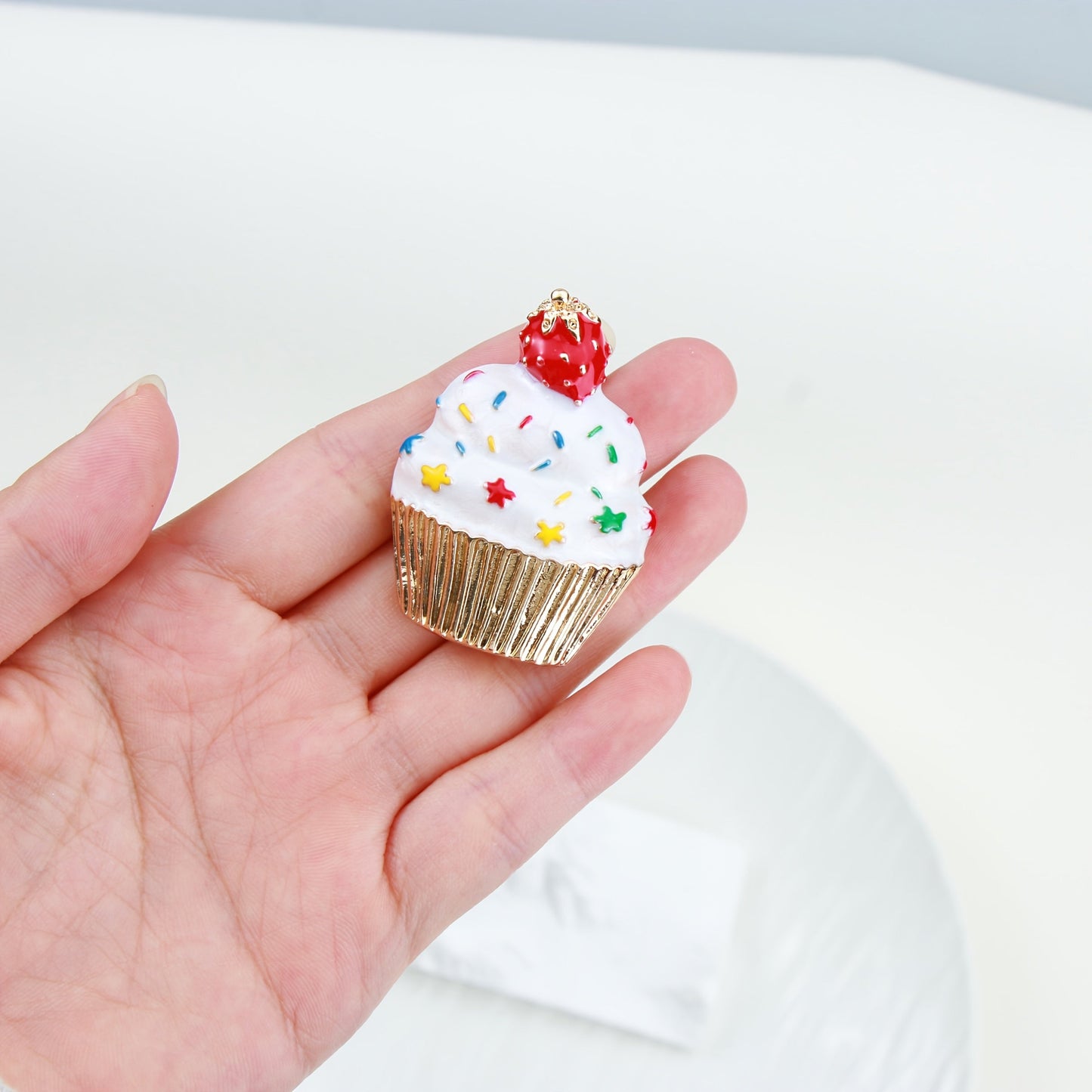 Add some festive flair to your holiday outfits with this adorable Cute Christmas Cupcake Brooch Pin. Crafted from enamel, this accessory is the perfect way to spread holiday cheer wherever you go.