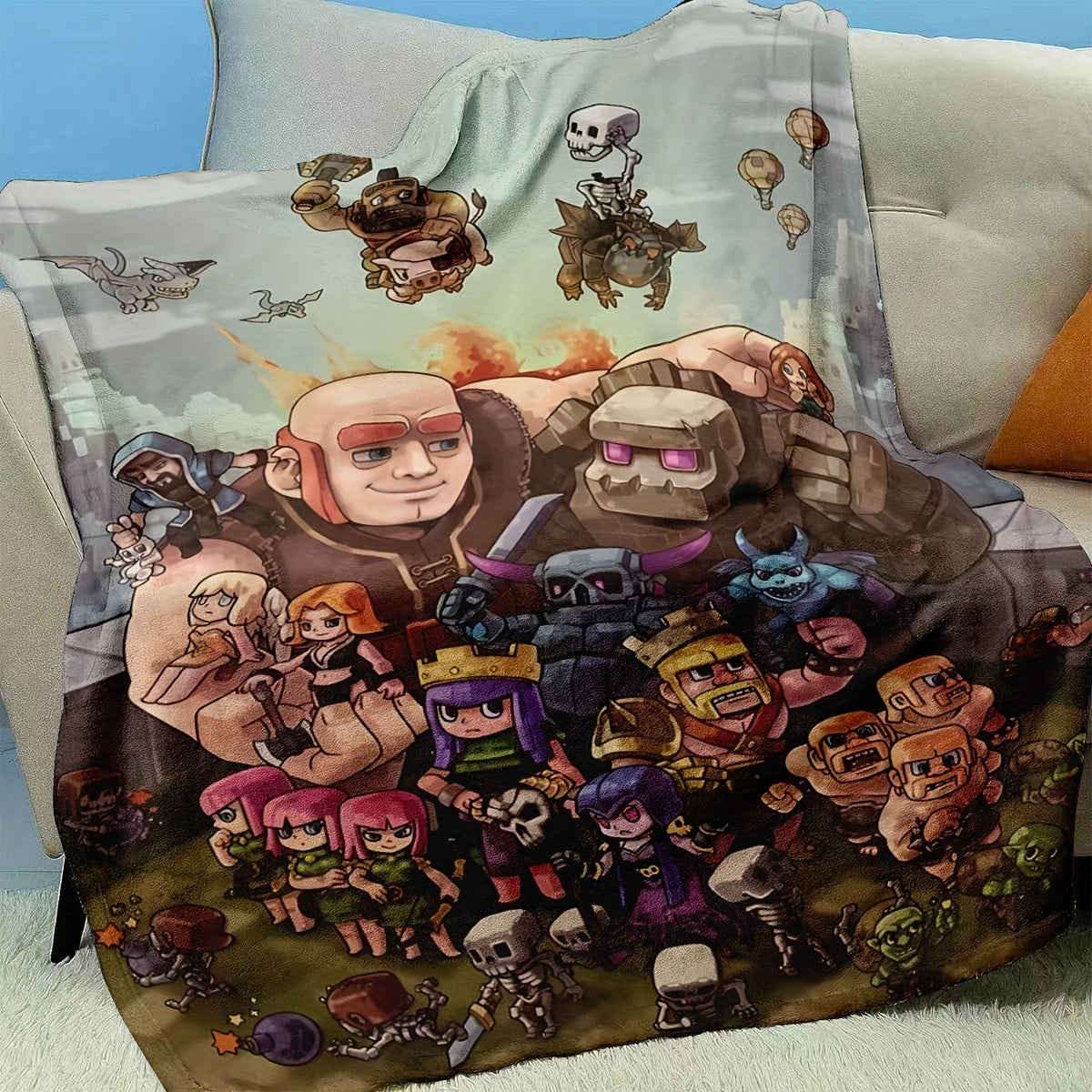 Flannel fleece blanket featuring Clash of Clans characters design, perfect for all seasons. This blanket is contemporary in style, machine washable, and made of polyester with anti-soil properties. The digital print design makes it suitable for gaming