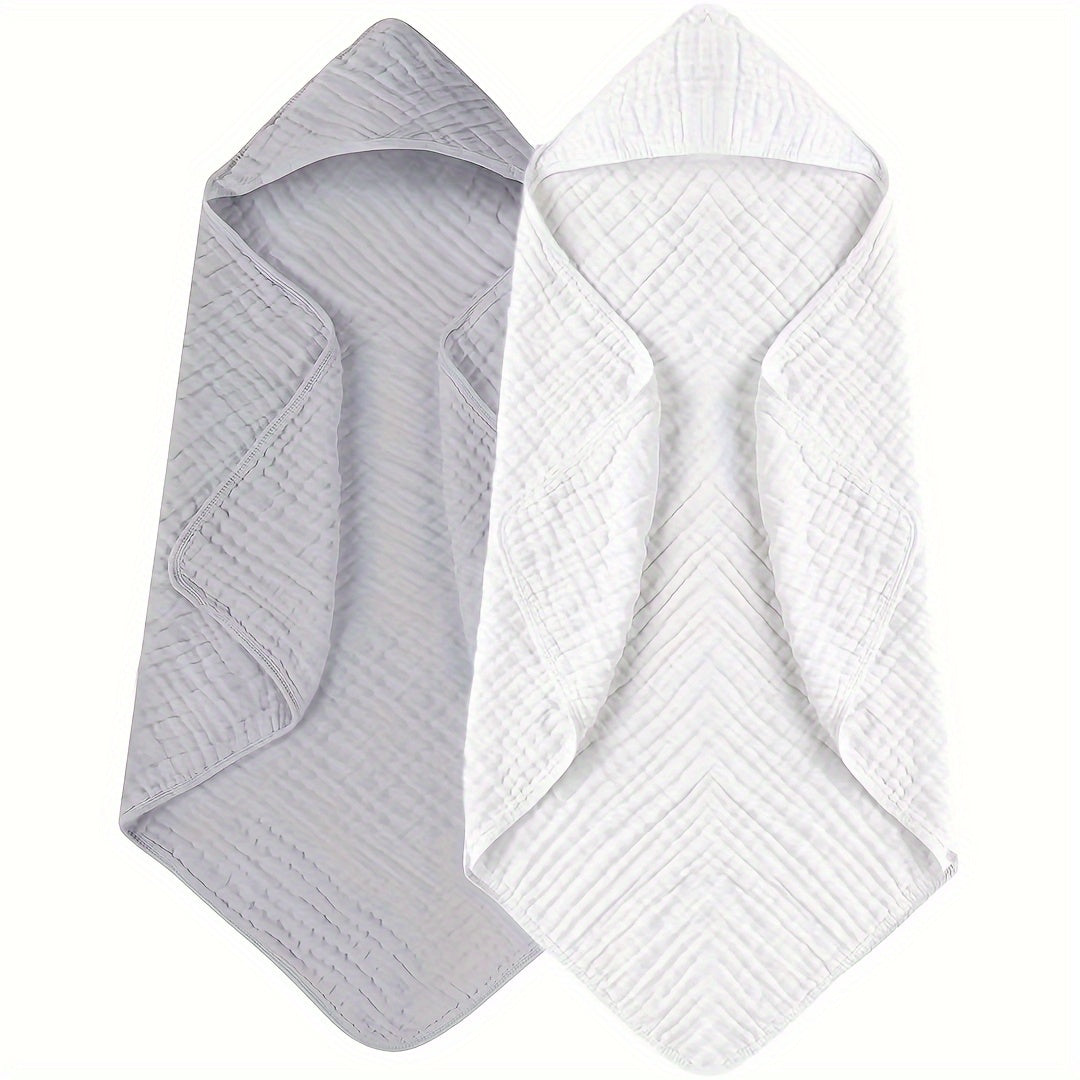 Two-pack of Bindi Monkey hooded baby towels made from 100% cotton for superior absorbency. These towels feature a cozy hood, perfect for infants and toddlers aged 0-3 years. Soft and comfortable, they can also be used as a swaddle blanket. Please hand