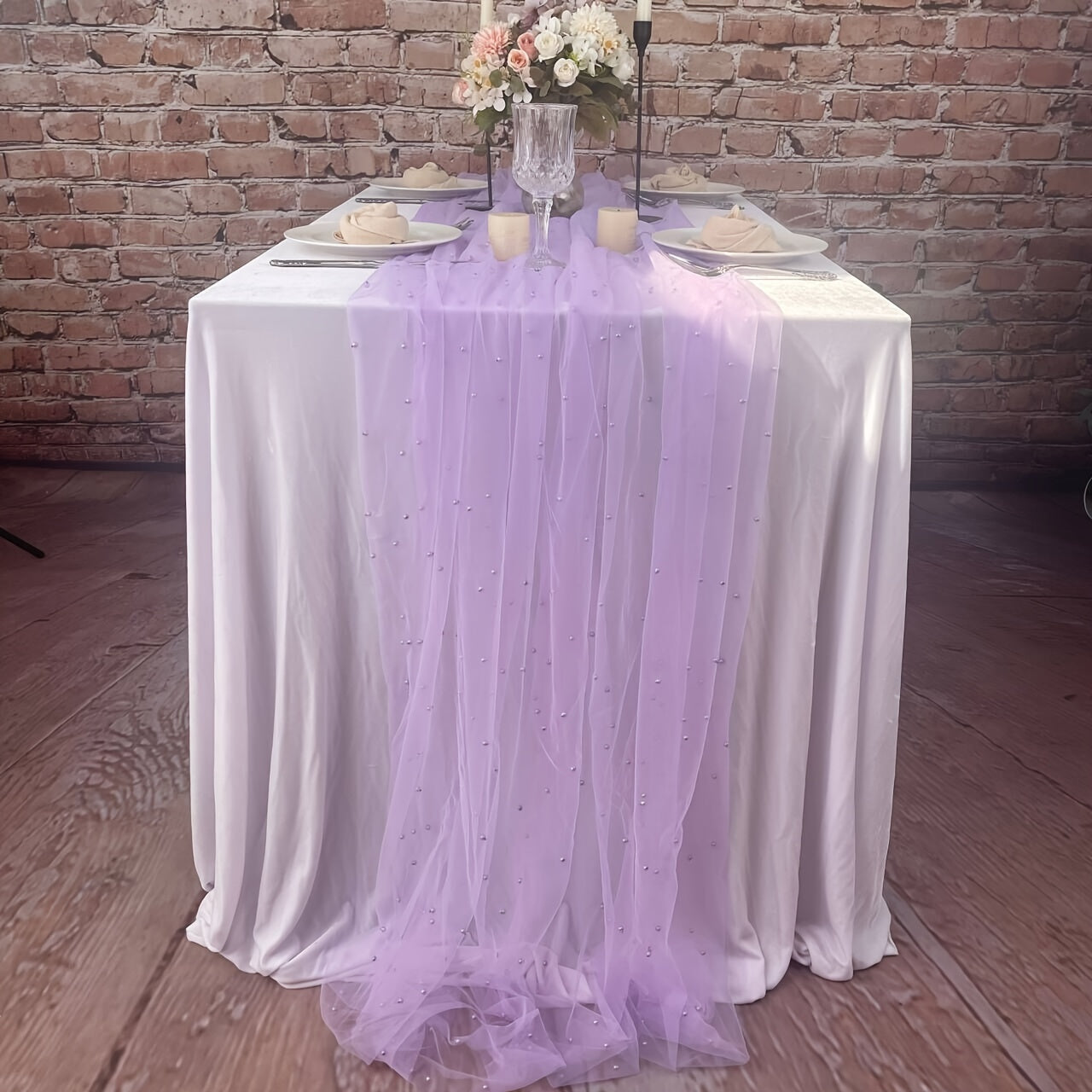 Enhance the ambiance of your special events with our Romantic Pearl Lace Table Runner. Perfect for weddings, bridal showers, and more, this elegant decoration is crafted from embroidered sheer chiffon tulle that is wrinkle-free for a luxurious look.