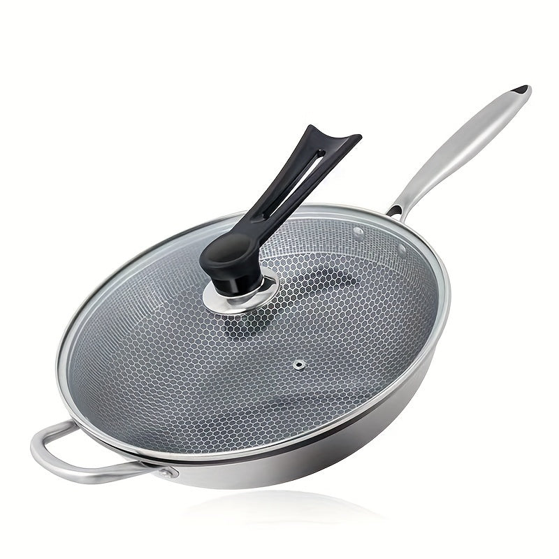 1-piece Stainless Steel Skillet with Lid featuring a thick honeycomb non-stick surface, perfect for cooking steak, eggs, and stir-fry dishes. This versatile pan is compatible with both induction and gas stoves, but should be hand washed for best results.