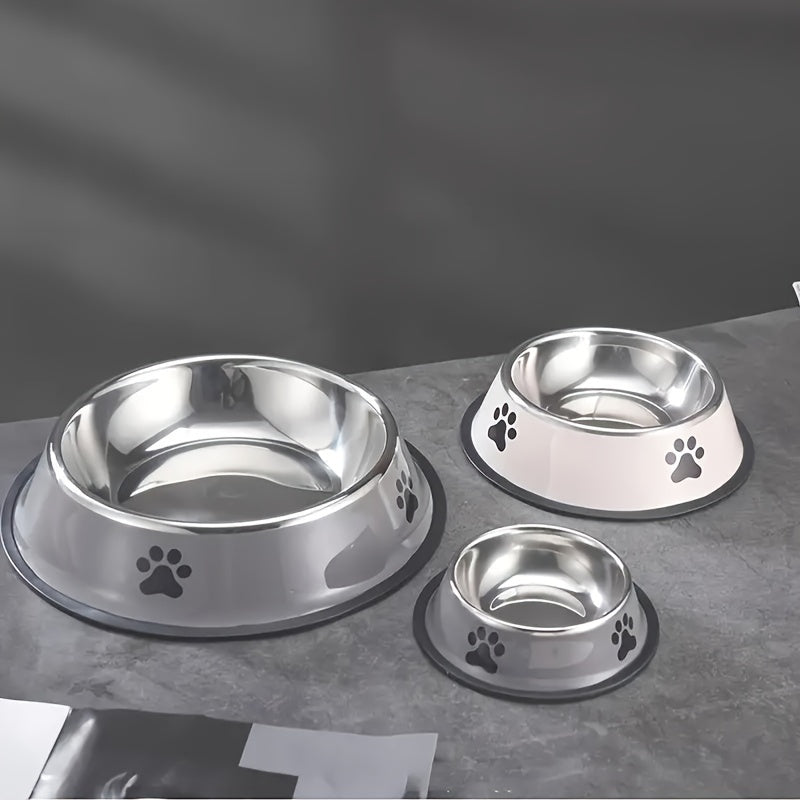 High-quality stainless steel pet bowl with non-slip base, easy to clean, ideal for dog and cat food or water, offered in three sizes.