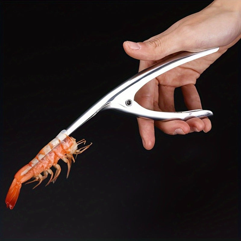 Effortlessly remove shrimp shells with this stainless steel deveiner peeler featuring a comfort grip handle. This kitchen utensil is designed for easy shrimp preparation and is made with food contact safe material.