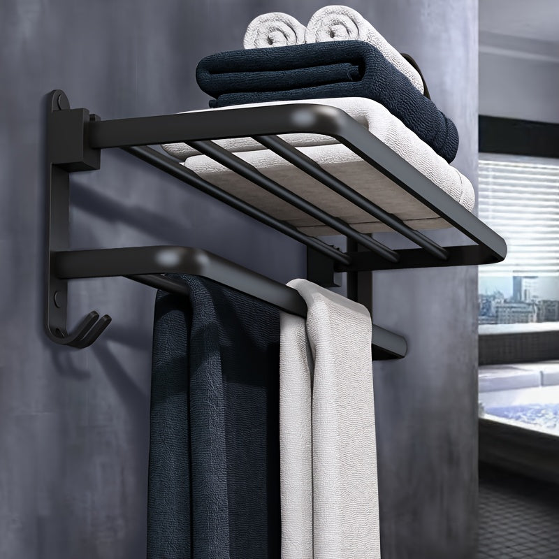 Compact black wall-mounted bathroom shelf with towel bar and hooks for convenient storage of towels, toiletries, and accessories. Easy to install with a sleek modern design and sturdy metal construction. Perfect towel holder for any bathroom.