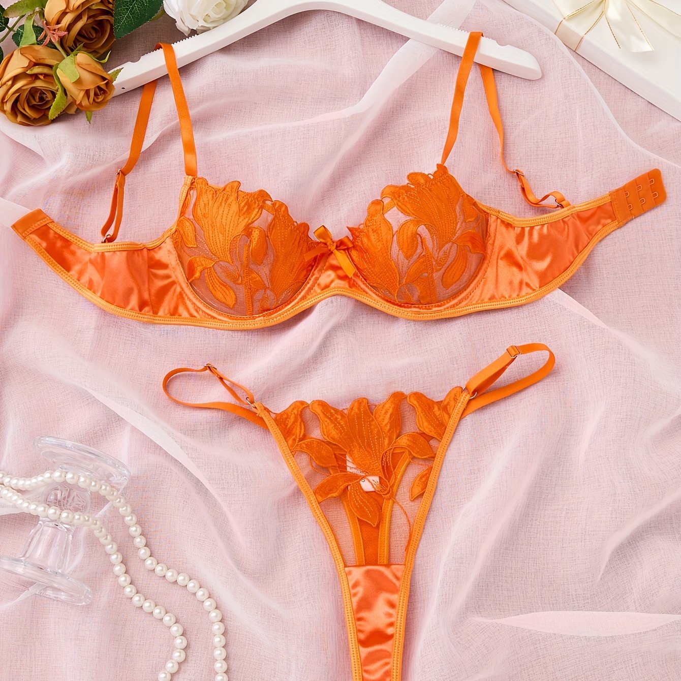 Floral embroidered lingerie set for women - sheer bra and thong panty, medium support, no padding, with polyester and elastane.