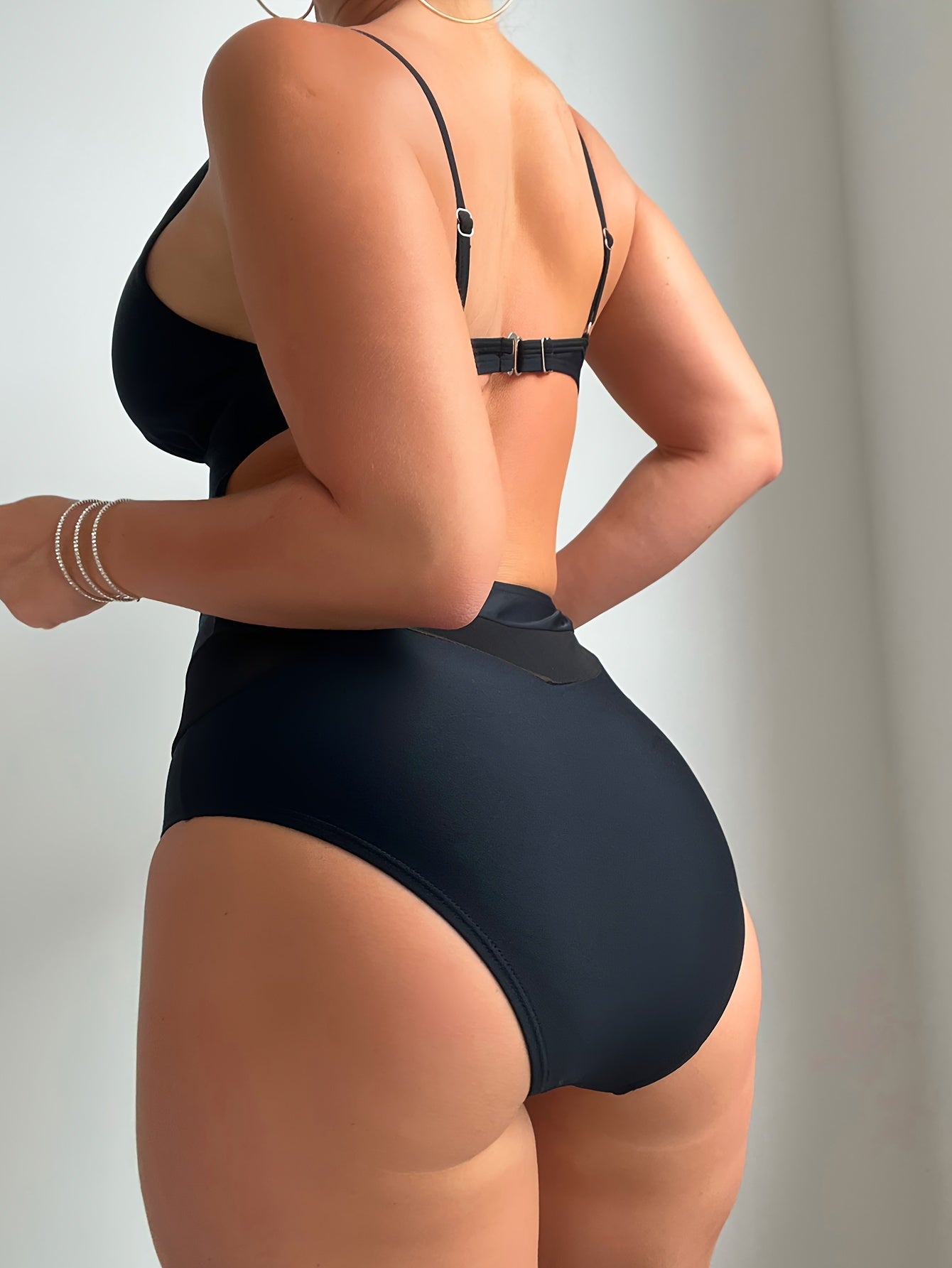 Seductive one-piece swimsuits with mesh high waist, plunging V-neck, and cut-out details.