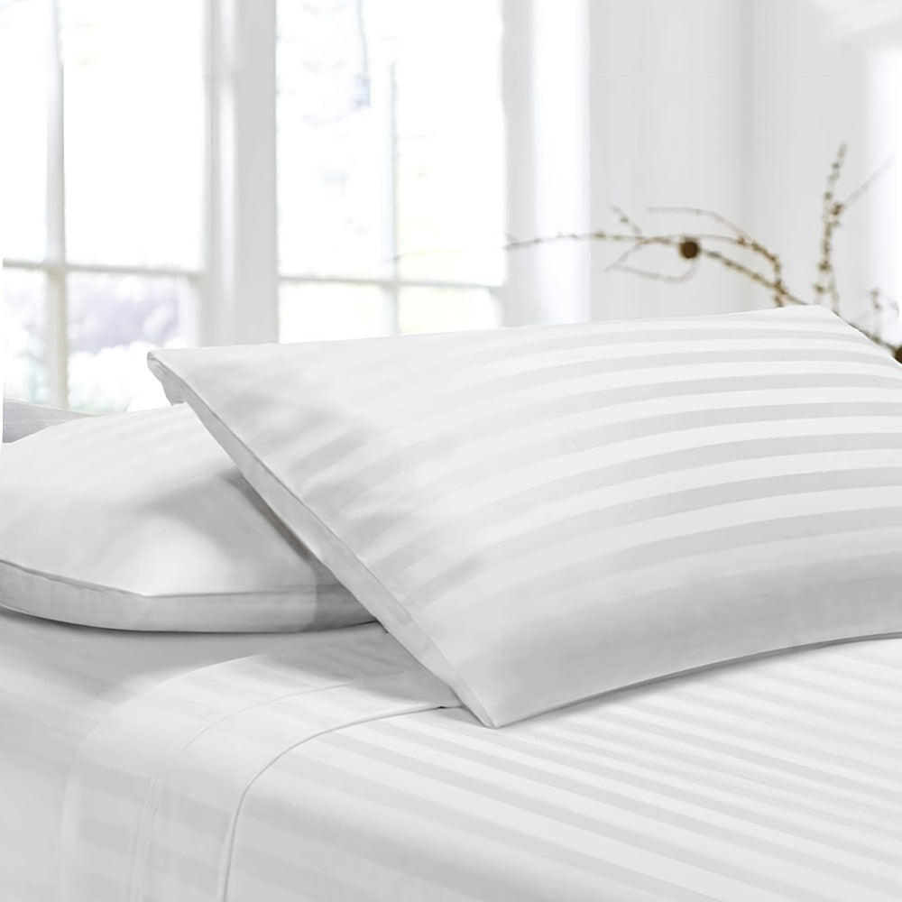 Pillowcase made with luxurious satin stripes, providing a soft, breathable, and durable option for both home and hotel use. Features envelope closure and is recommended for dry clean only. Available in white and khaki colors.