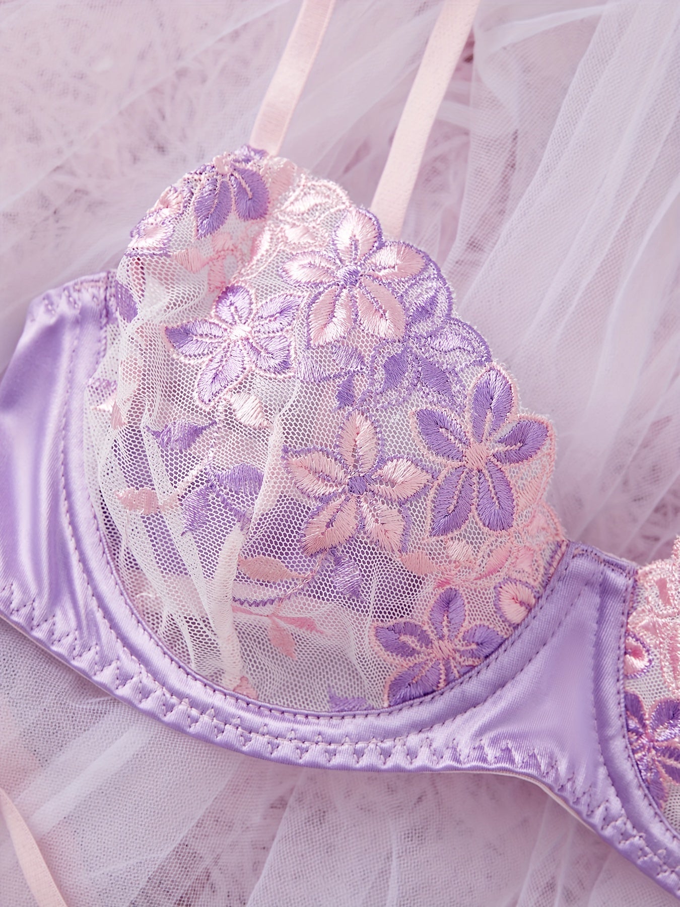 Women's sexy lingerie set featuring a flower design bra and thong.