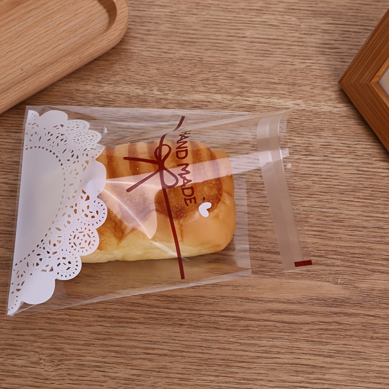 Elegant Lace Bow Print Treat Bags - Set of 100, Self-Adhesive, Transparent & White - Great for Cookies, Candy, Snacks - Food-Safe Plastic, Perfect for Weddings, Gifts, Baking Packaging.