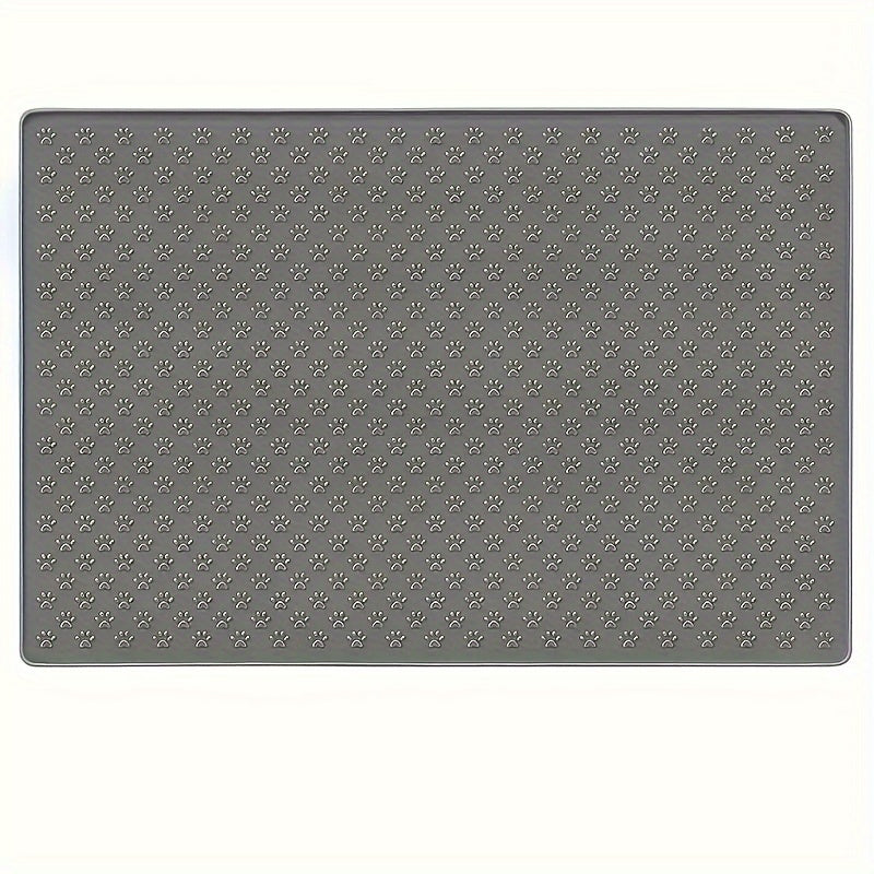 Gray pet feeding mat with paw print design, prevents spills and mess, ideal for cats and dogs.