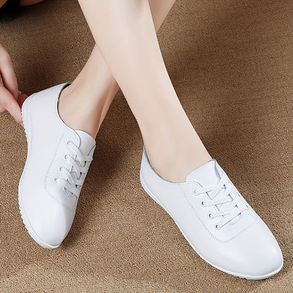 Women's lightweight solid color lace-up flat shoes for casual walking.