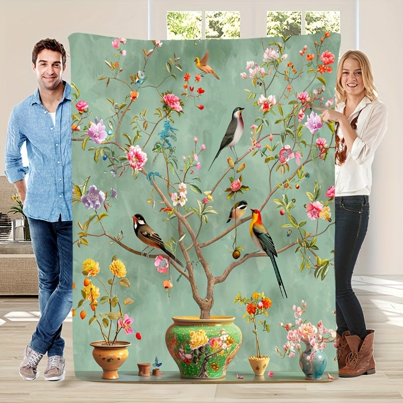 Soft, Portable Green Floral & Bird Print Fleece Blanket. This tear-resistant and stain-proof blanket is made from 100% polyester, offering all-season comfort. Perfect for home decor and travel, it is also machine washable for easy care.