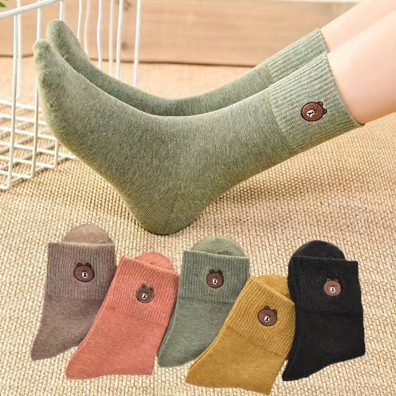 5 pairs of cozy and cute bear-themed mid-calf socks in solid color knitted fabric for warmth in autumn and winter.