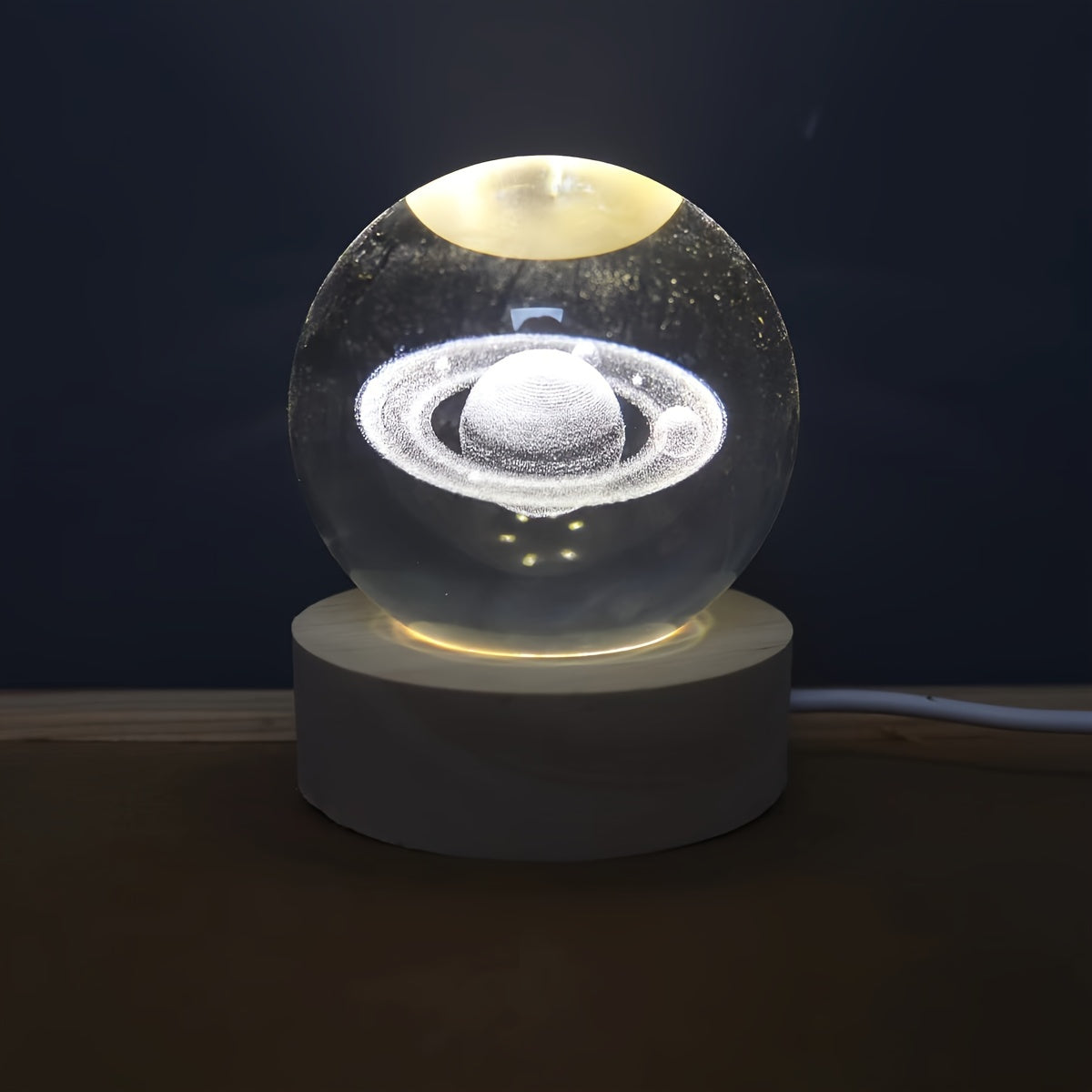 USB-powered Crystal Saturn night light emits celestial glow.