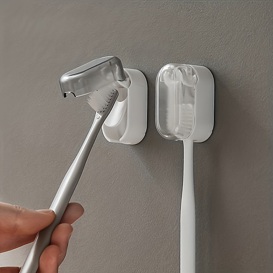 Wall-mounted toothbrush holder with cover, suitable for bathroom storage and decoration.