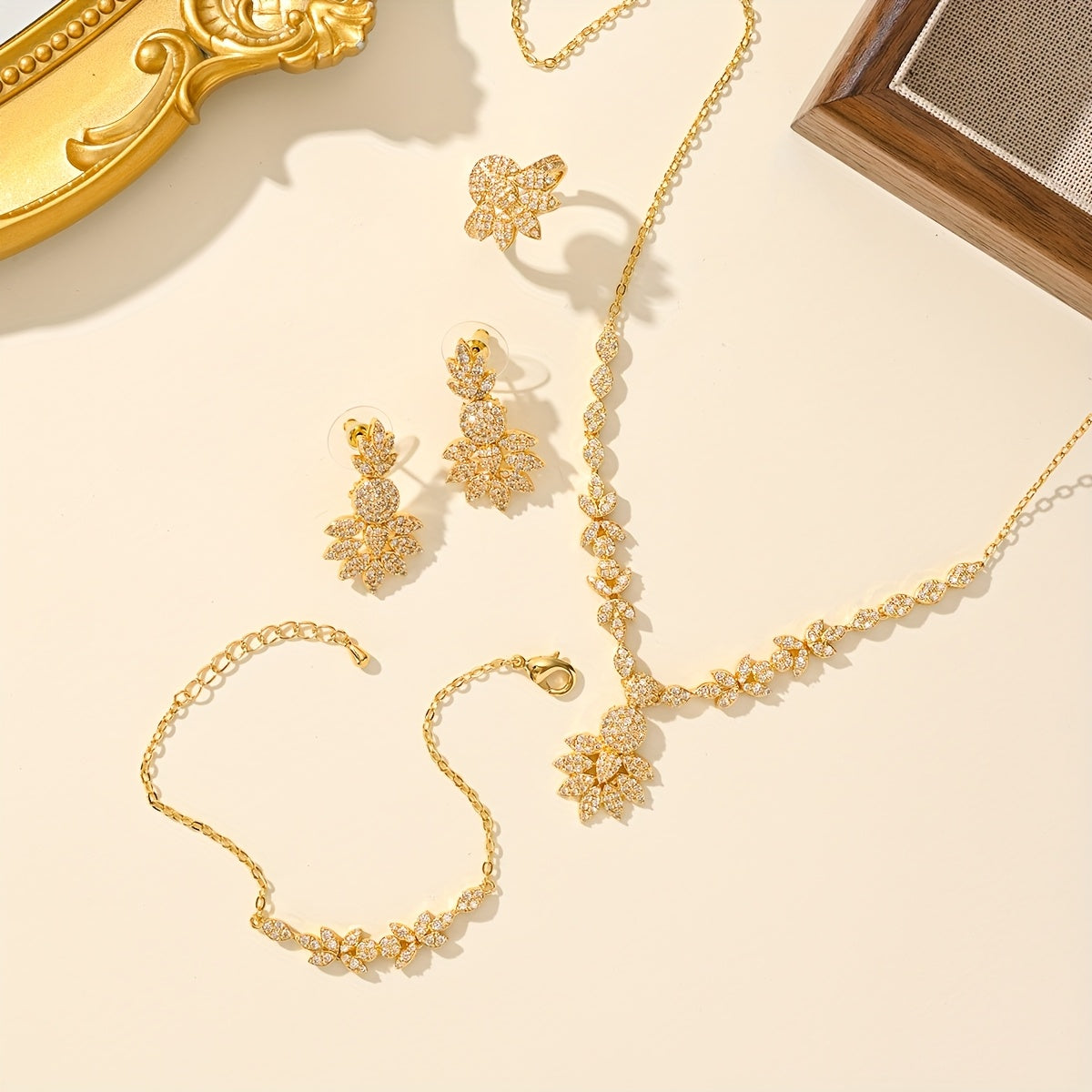 Luxurious 5-piece Jewelry Set for Women, Featuring 18K Gold-Plated Copper adorned with Synthetic Zirconia Stones in a Stunning Floral Design. Includes Necklace, Earrings, Bracelet, and Ring, Perfect for Everyday Wear or Special Wedding Occasions.