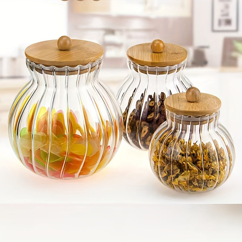 Glass storage jar with bamboo lid featuring stripes - perfect for storing tea, snacks, seasonings, and candy in the kitchen or dining room. Can be used multiple times.