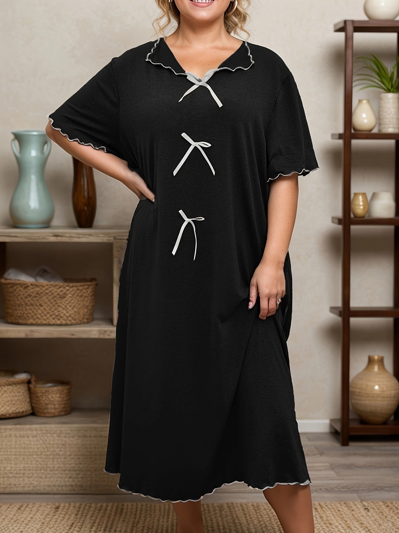 Plus size casual sleep dress with bow decor and short sleeves.