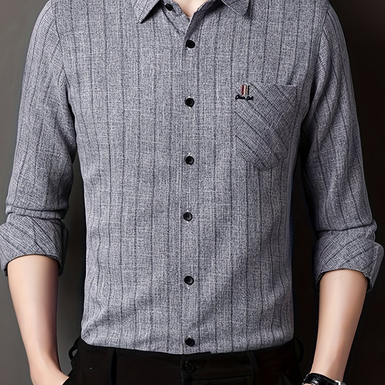 Men's striped shirt with chest pocket, collar, and long sleeves.