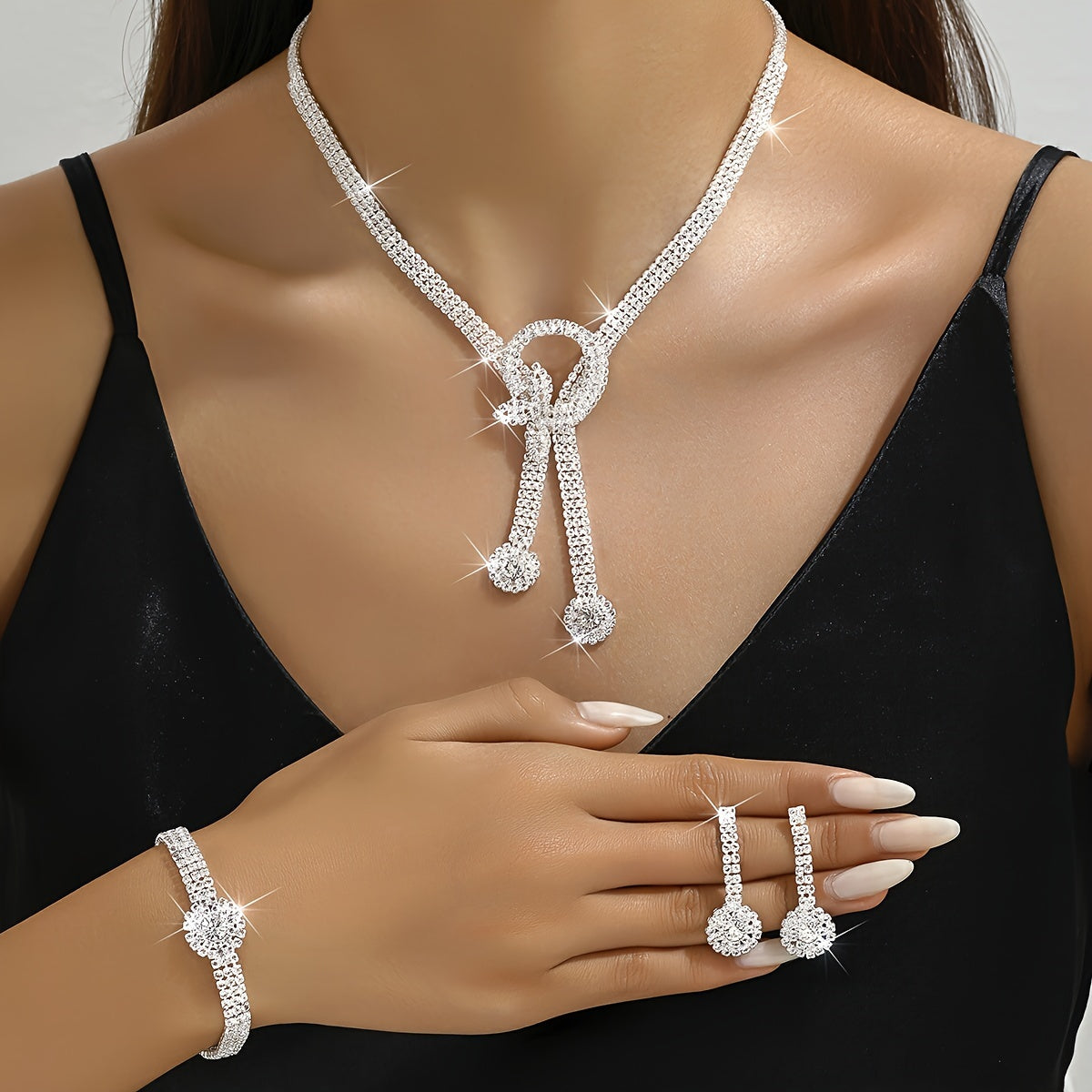 Complete your evening dress look with this elegant European and American jewelry set featuring a Rhinestone Tassel Necklace and matching earrings. The set exudes sophistication and style with its full diamond accents, perfect for adding a touch of