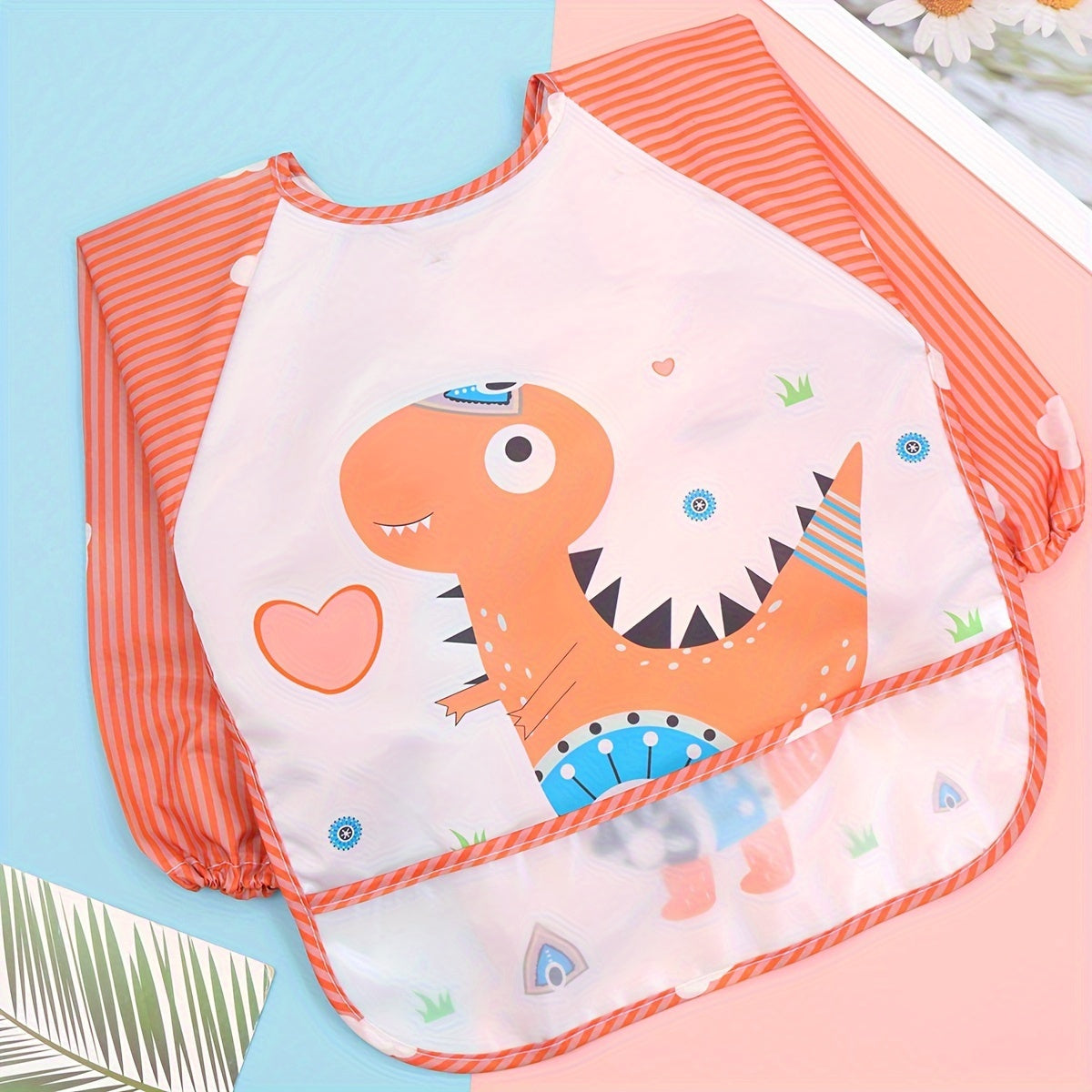 Easily cleanable reverse wear cartoon bib with waterproof long sleeves, suitable for home and travel.