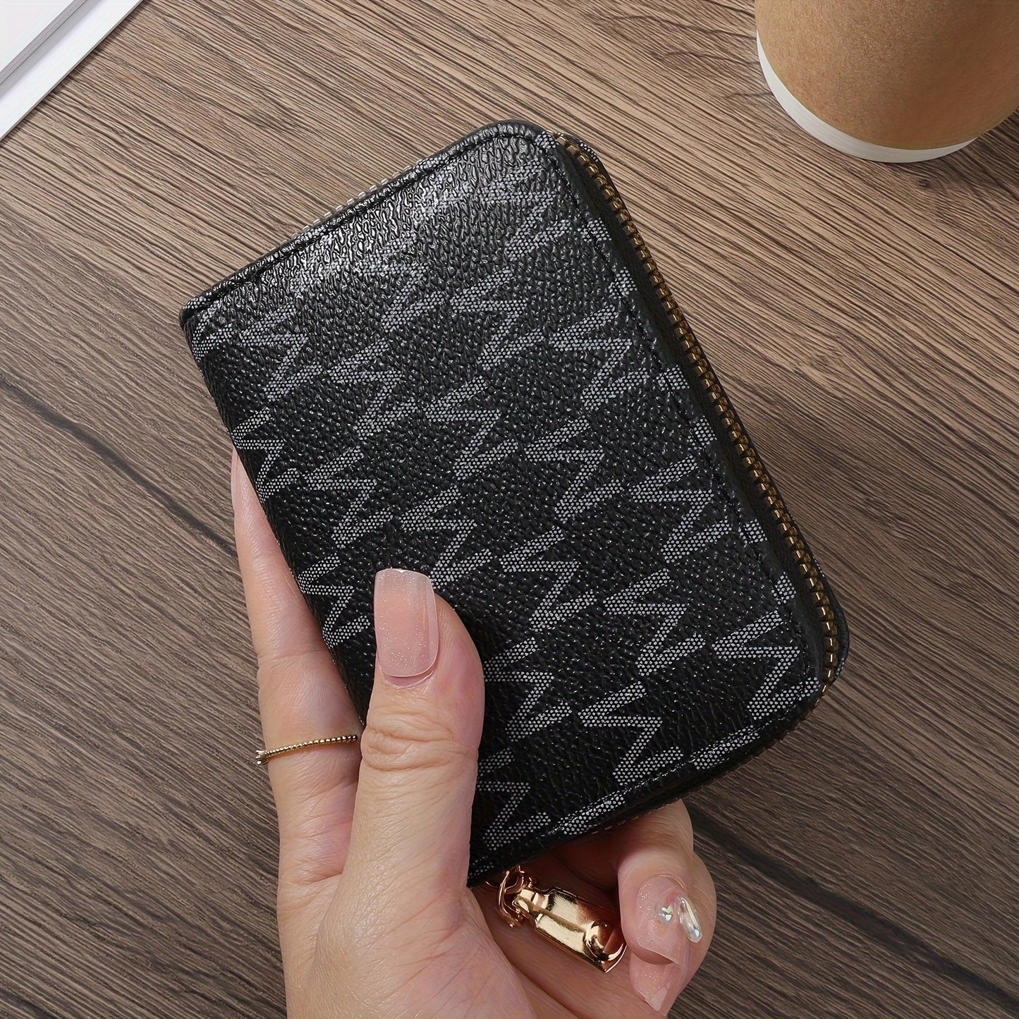 Compact and stylish synthetic leather credit card holder with zipper in brown and black herringbone pattern. Includes golden zippers, ideal for keys and cash. Lightweight and portable