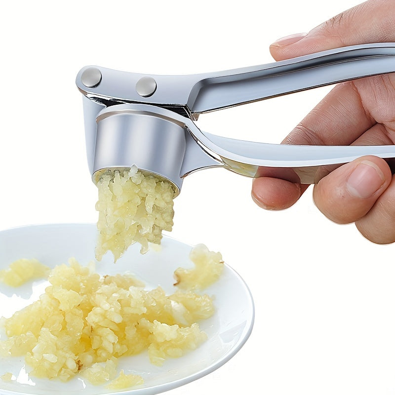 Handheld metal garlic press for manually crushing garlic and ginger in the kitchen.Ideal for kitchen accessories.