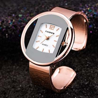 Luxury women's wrist watch with hollow dial, round analog display, alloy case and strap, and button battery for fashion accessory.