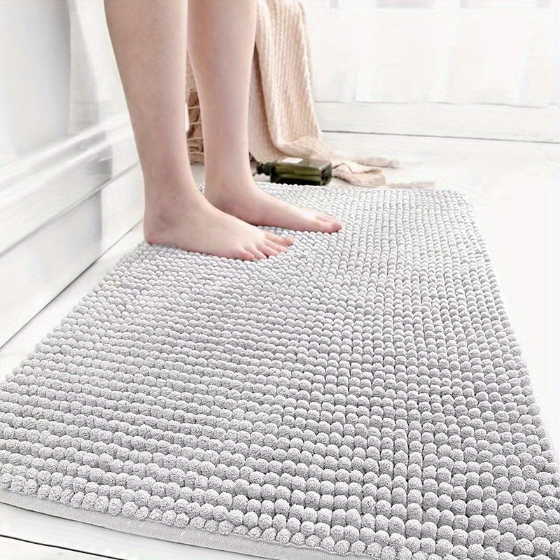 Get this luxurious Chenille Bath Mat, 2cm Thick, with a non-slip, super absorbent, quick-dry design. Made of woven polyester with rubber backing, this mat weighs 1450gsm and is perfect for the bathroom, kitchen, bedroom, or entryway. It also makes a