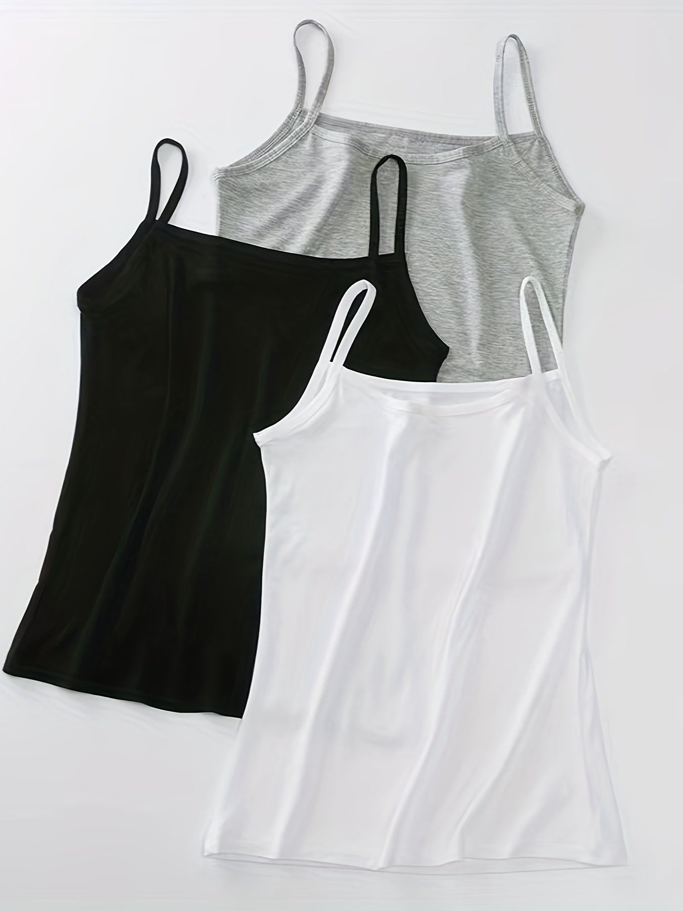 3 Women's Modal Camisole Tops in Black, White, and Gray, perfect for both casual wear at home and outdoor activities. Made with a stretchy spaghetti strap sleeveless design that is