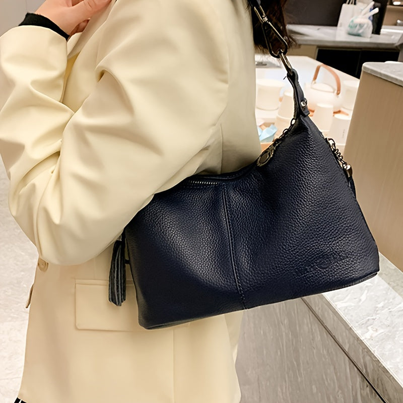 Women's genuine leather shoulder bag with large capacity, adjustable strap, zipper closure, casual style in black or blue. Ideal for daily commute, shopping, and travel gifts.