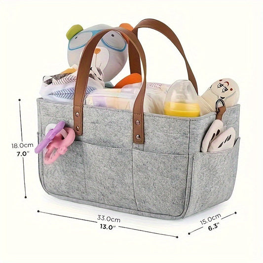 Portable and versatile Grey Patchwork Felt Diaper Caddy with convenient handles for organizing diapers. No electricity required with a sustainable wood-free design.