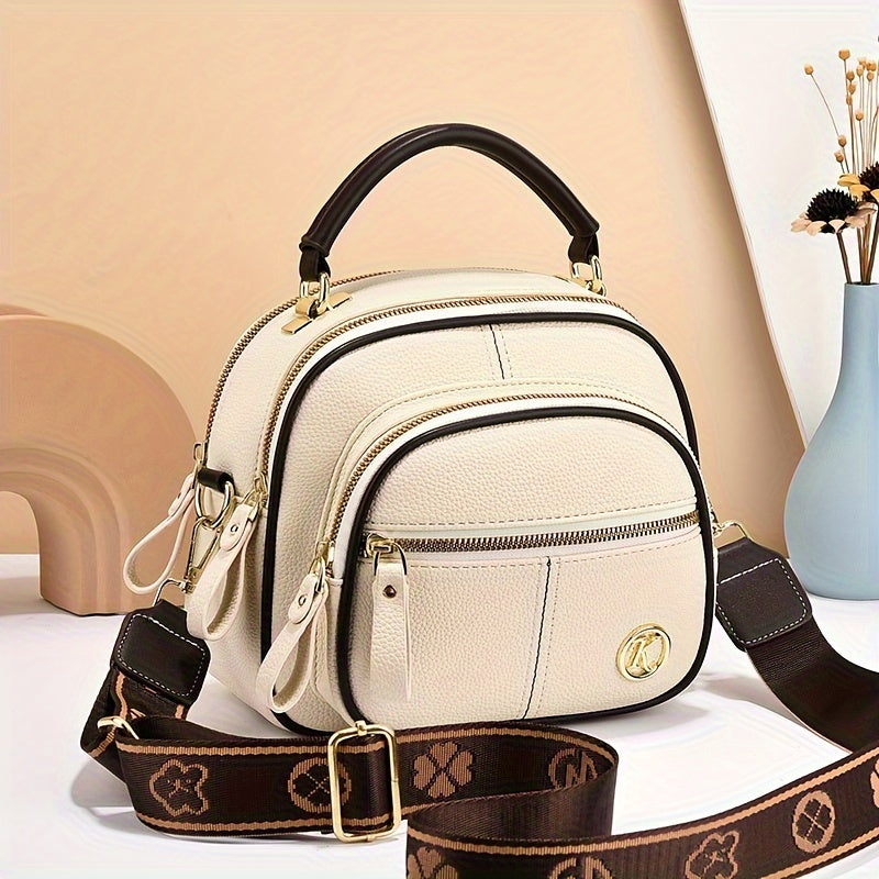 Versatile small handbag with multiple pockets and adjustable strap for women's fashion.