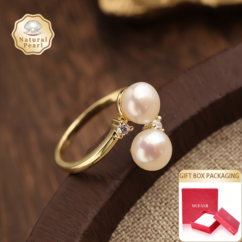 This elegant and unique pearl ring is the perfect accessory for women. It features two 6-7mm natural freshwater pearls on an open ring design, making it a fashionable and personalized piece. Ideal for weddings or as a special gift, this ring comes