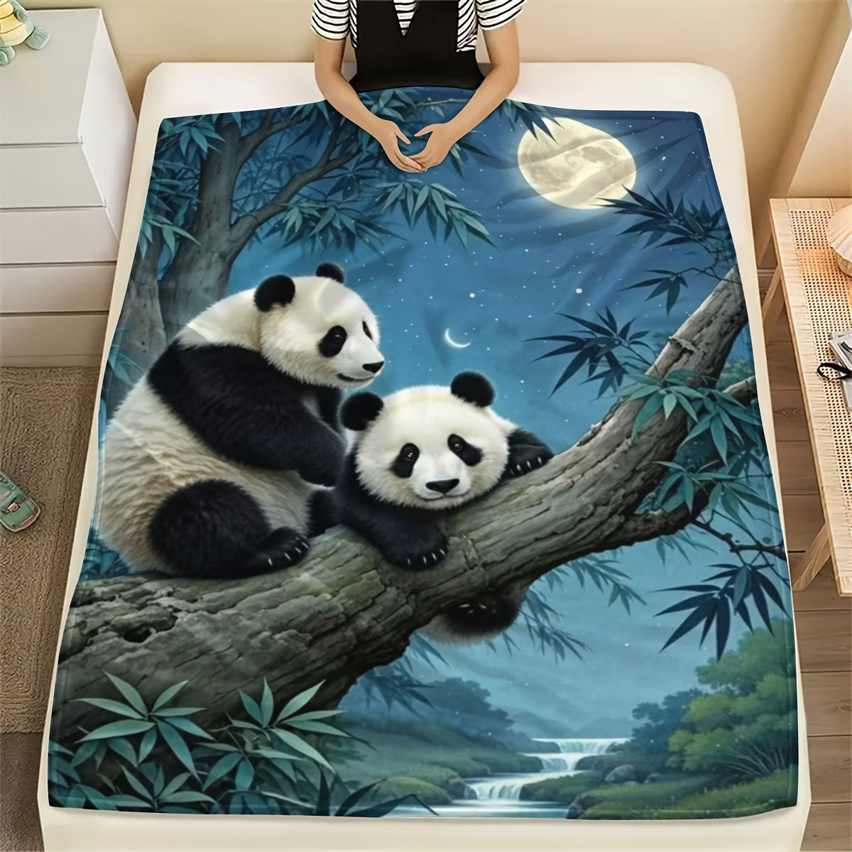 Soft and cozy all-season flannel throw blanket featuring a panda print on a moonlight scene. Perfect for gifting on holidays, birthdays, and Christmas. Made of 100% polyester, this blanket is perfect for bed, sofa, living room, or bedroom decor. Enjoy