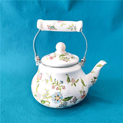 A stylish 1.5L enamel kettle, featuring an aromatic floral design and pear-shaped body. Safe for use on gas and induction cookers, perfect for brewing tea and making cold drinks. Includes a built-in strainer for easy use.