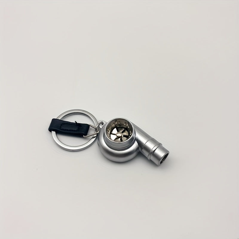 Keychain featuring a rotating turbine design, perfect for car enthusiasts. This creative accessory also doubles as a key holder and includes a turbine whistle feature. Ideal as a unique gift option.