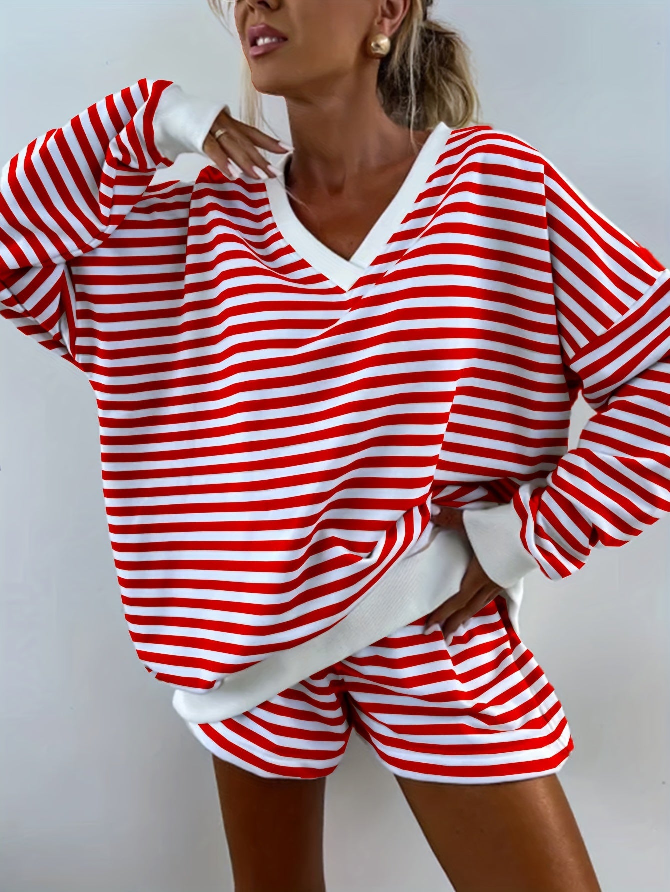 Striped lounge set for women, loose fit with long sleeve top and shorts, perfect for comfy fall wear.